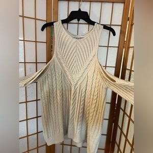 Cold shoulder sweater with pearl accents